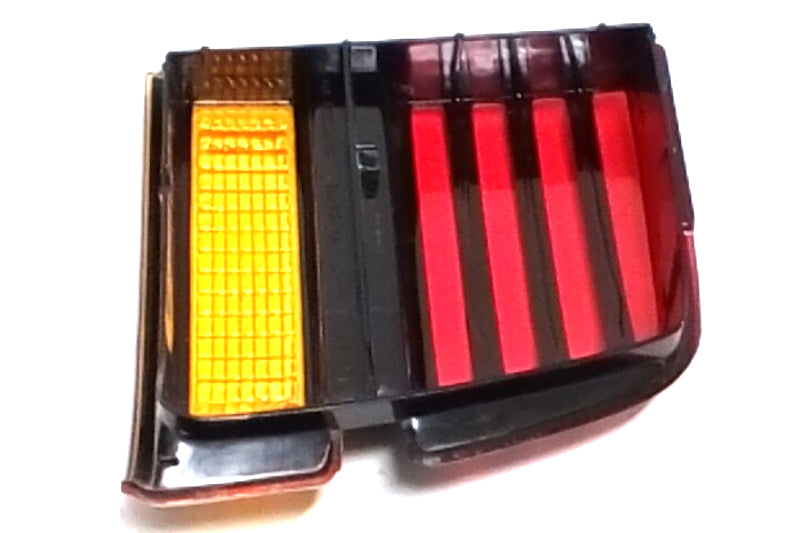 New OEM 1988-1991 Pontiac Sunbird Driver Rear Tail Light, Part # 16508821